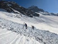 Avalanche cone crossing in the Ducan valley near Monstein, Sertig Davos. Ski touring in the mountains. Royalty Free Stock Photo