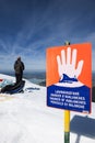 Avalanche danger sign with man vertical