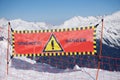 Avalanche danger sign in snow, winter mountains Royalty Free Stock Photo