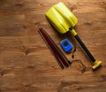 Avalanche rescue kit, lying on wooden floor.