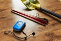 Avalanche rescue kit, lying on wooden floor.