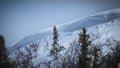 Avalanche risk zone. Landscape with dramatic cliff side on snowy mountain Royalty Free Stock Photo