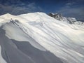 Avalanche snow cornice. Be careful of snow cornices on the mountain ridge. Avalanche went down. Girenspitz Schafberg Royalty Free Stock Photo