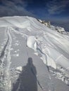 Avalanche snow cornice. Be careful of snow cornices on the mountain ridge. Avalanche went down. Girenspitz Schafberg Royalty Free Stock Photo