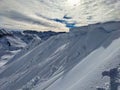 Avalanche snow cornice. Be careful of snow cornices on the mountain ridge. Avalanche went down. Girenspitz Schafberg Royalty Free Stock Photo