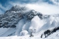 avalanches and snowstorms in the mountains of the wilderness, with a view of towering peaks