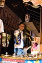 Young dondurma ice-cream seller dressed in traditional Turkish costume in the street shop.