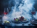 Avant Garde Molecular Gastronomy Dishes with Levitating Elements and Dramatic Chiaroscuro Lighting Royalty Free Stock Photo