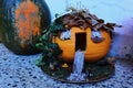 Avantgarde halloween carved pumpkin jack o lantern as house in woods, possibly witch house