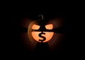 Avaricious insatiable Halloween pumpkin love a money, U.S. dollars on black Royalty Free Stock Photo