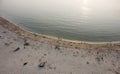 Aveiro, Portugal - Agosto 2018: Aerial view of peaceful Barra Beach with few people. Gentle waves and sun glare in water