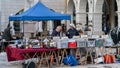 Couple selling retro record and items at monthly street flea market in Aveiro, Portugal