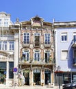 Aveiro, Portugal / August 23, 2017: Classical facade of the village very decorated with pink mosaics representing flowers in