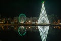 AVEIRO, PORTUGAL - CIRCA DECEMBER 2018: Fonte Nova`s garden with Christmas market and colored ferris wheel near Ria de Aveiro at Royalty Free Stock Photo