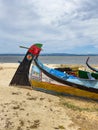 AVEIRO, PORTUGAL - JUL 5, 2023: Typical boats in the fishing that used to harvest algae on Aveiro lagoon once Village of Torreira