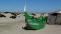 Aveiro, Portugal-DecembBoat stranded on the dune and broken wooden house.