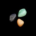 Aventurine stones on black background