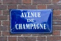 Avenue de Champagne sign on red brick wall in Epernay, France