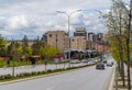 Avenue with driving cars and the Pristina cityscape in the background