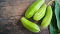 Averrhoa starfruit or Oxalidaceae, Cucumber Fruit with wood texture background