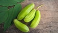 Averrhoa starfruit or Oxalidaceae, Cucumber Fruit with wood texture background