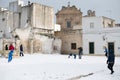 Avetrana, Italy - January 5, 2019. Group of young people playing outdoor snowballs in snowy square after snowfall in Puglia,