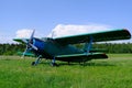 A small airplane is at the small aerodrome.