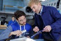 Aviation engineer in duscussion with superior