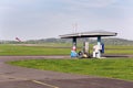 Aviation fuel filling station on airport with airfield runway in background
