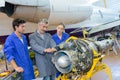 Aviation technician studying part