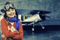 Aviator, happy girl ready to travel with plane. Royalty Free Stock Photo