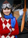 Aviator, happy girl ready to travel with plane. Royalty Free Stock Photo