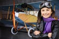 Aviator, happy girl ready to travel with plane. Royalty Free Stock Photo