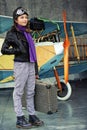 Aviator, happy girl ready to travel with plane. Royalty Free Stock Photo