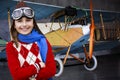 Aviator, happy girl ready to travel with plane. Royalty Free Stock Photo