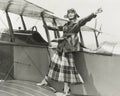 Aviatrix standing on bi-plane Royalty Free Stock Photo