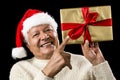 Avid Aged Man Pointing At Golden Wrapped Present