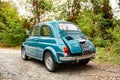 Avigliana, Italy. October 10th, 2020. Back view of old classic FIAT 500L in blue marine color parked along the road leading to the