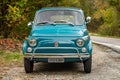 Avigliana, Italy. October 10th, 2020. Front view of classic old FIAT 500L in blue marine color parked along the road leading to