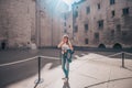 Avignon, Vaucluse/France - September 27, 2018: blonde in headphones with an audio guide in the Avignon Papal Palace