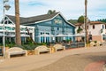 Avila Beach city promenade filled with restaurants, shops, patios, benches, and art Royalty Free Stock Photo