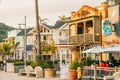 Avila Beach city promenade filled with restaurants, shops, patios, benches, and art. Sunset in the city, dinner time Royalty Free Stock Photo