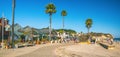 Avila Beach city promenade filled with restaurants, shops, patios, benches, and art Royalty Free Stock Photo