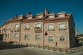 Building on deserted alley with Spanish flag at Avila Royalty Free Stock Photo