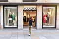 Avila, Spain - September 04, 2021: Woman entering a young Mango clothing store
