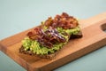 Avocado bacon on sunflower seed whole grain bread slice for breakfast or snack Royalty Free Stock Photo