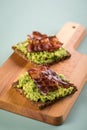 Avocado bacon on sunflower seed whole grain bread slice for breakfast or snack Royalty Free Stock Photo