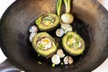 Avocado baked with quail eggs, fresh onion