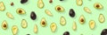 Avocado banner. Background made from isolated Avocado pieces on green background. Flat lay of fresh ripe avocados and avacado
