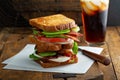 Avocado BLT sandwiches on wooden surface Royalty Free Stock Photo